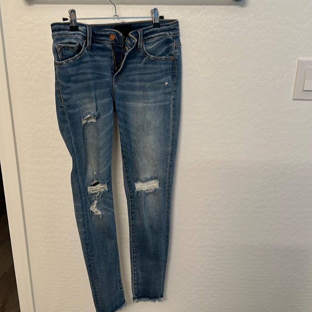 Buckle black skinny jeans